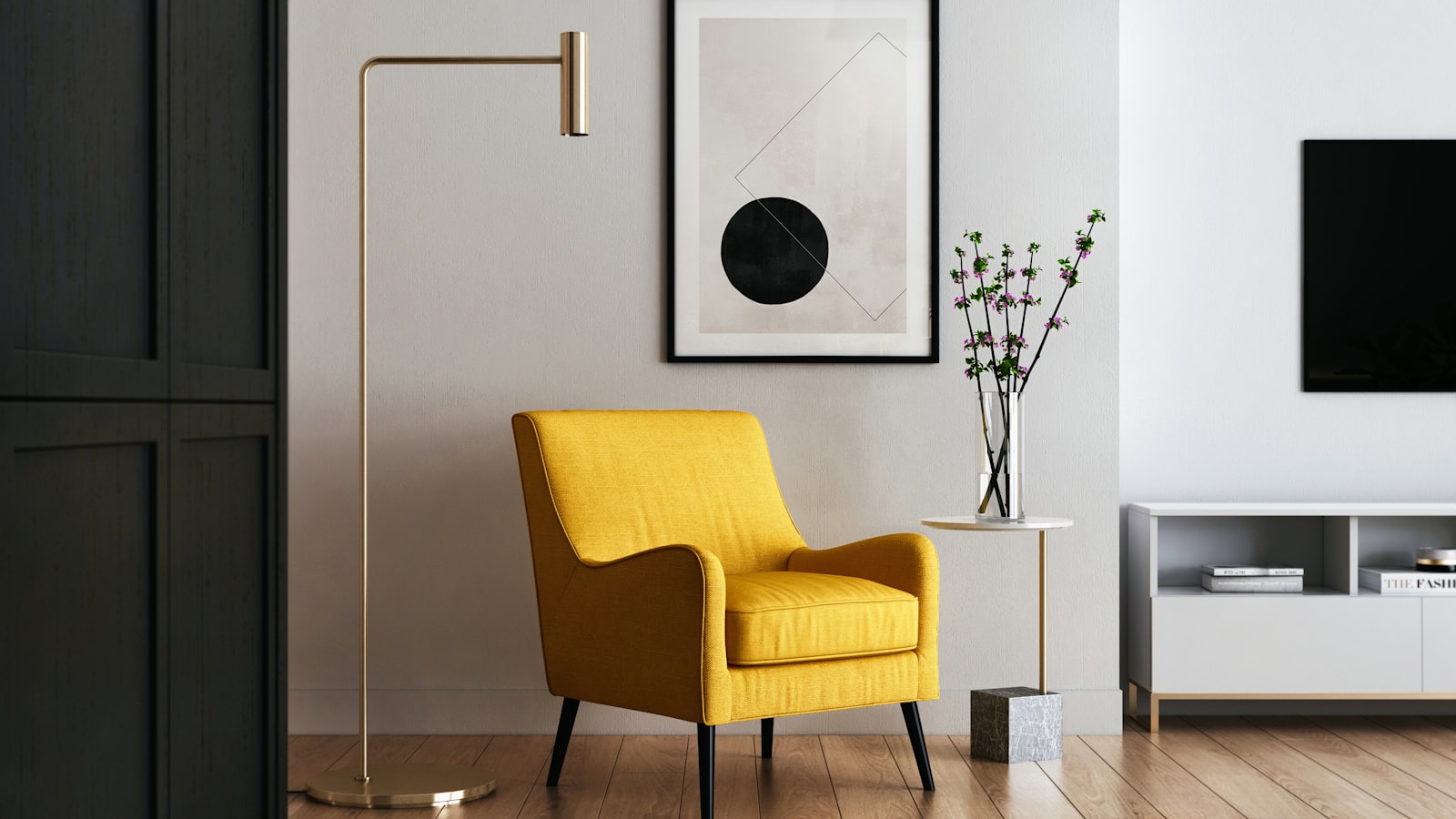 Modern living-room corner styled with a mustard yellow armchair, brass floor lamp, and framed abstract art